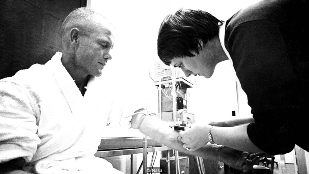 Nurse Dolores Dee O'Hara draws a blood sample from astronaut John Glenn. Credit NASA